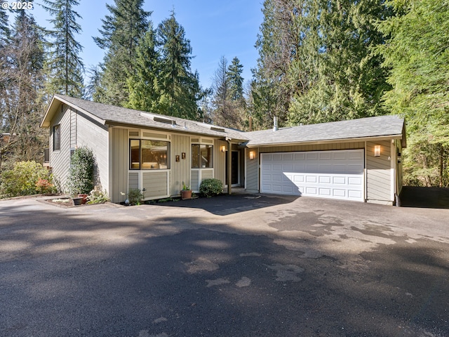 view of front of house featuring driveway and an attached garage