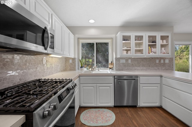 9435 SE 282nd Ave, Boring, OR 97009 - kitchen featuring stainless steel appliances, dark wood-style flooring, light countertops, glass insert cabinets, and white cabinets