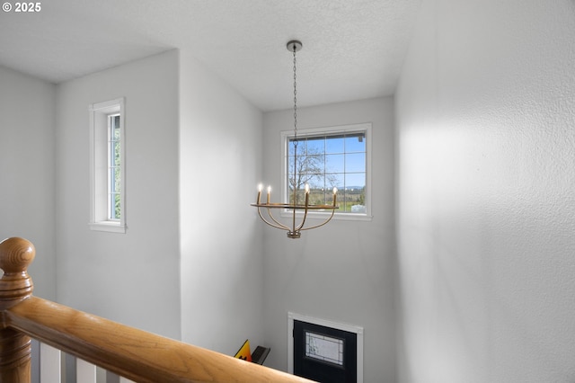 9435 SE 282nd Ave, Boring, OR 97009 - detailed view of a chandelier, a fireplace, and a textured ceiling