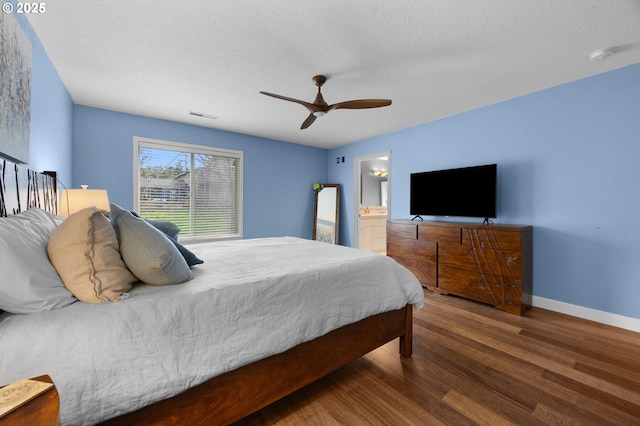 9435 SE 282nd Ave, Boring, OR 97009 - bedroom featuring wood finished floors, a ceiling fan, a textured ceiling, and connected bathroom