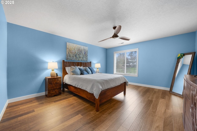 9435 SE 282nd Ave, Boring, OR 97009 - bedroom with wood finished floors, a textured ceiling, and ceiling fan