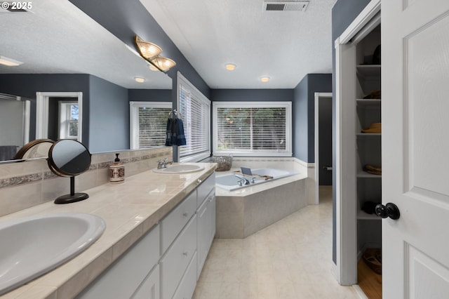 9435 SE 282nd Ave, Boring, OR 97009 - full bath with plenty of natural light, a garden tub, double vanity, and a textured ceiling