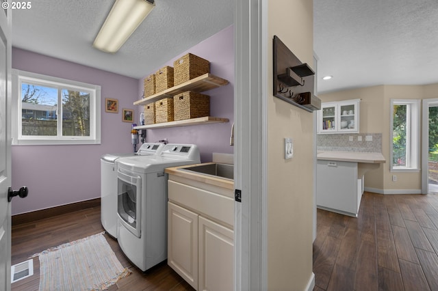 9435 SE 282nd Ave, Boring, OR 97009 - laundry area featuring independent washer and dryer, cabinet space, dark wood-type flooring, a textured ceiling, and recessed lighting