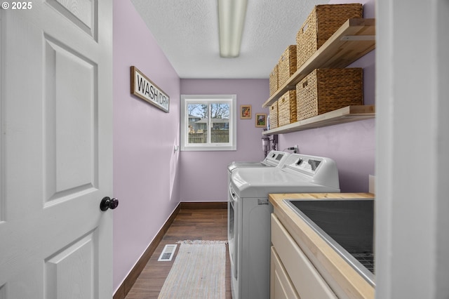 9435 SE 282nd Ave, Boring, OR 97009 - laundry area featuring washer and dryer, dark wood-style flooring, and a textured ceiling