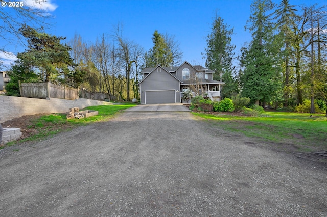 9435 SE 282nd Ave, Boring, OR 97009 - view of front of home featuring a garage, dirt driveway, and a porch