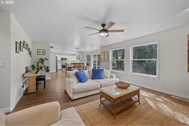 9435 SE 282nd Ave, Boring, OR 97009 - living room with a ceiling fan and wood finished floors