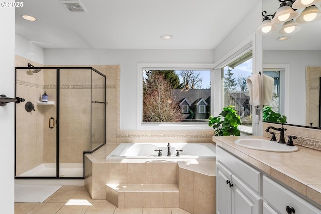 full bath featuring a shower stall, visible vents, a bath, and vanity