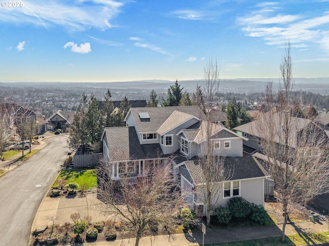 bird's eye view with a residential view and a mountain view