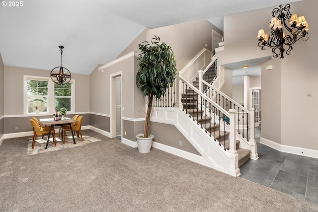 interior space featuring lofted ceiling, stairway, baseboards, and an inviting chandelier