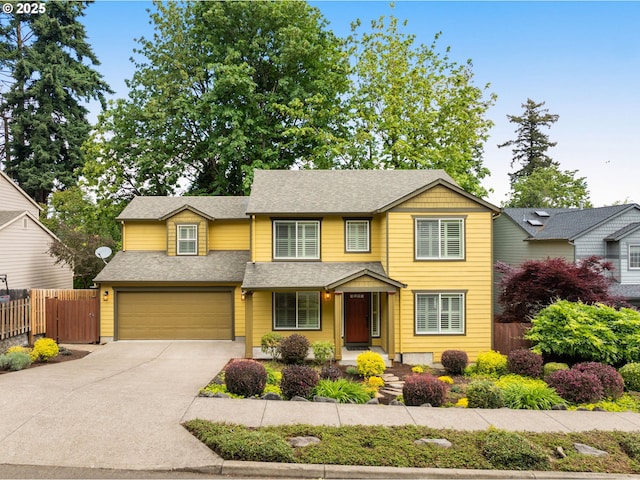3543 SE Wister St, Milwaukie, OR 97222 - traditional home with driveway, an attached garage, and roof with shingles