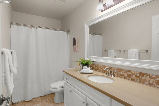 3543 SE Wister St, Milwaukie, OR 97222 - bathroom featuring vanity, toilet, and backsplash