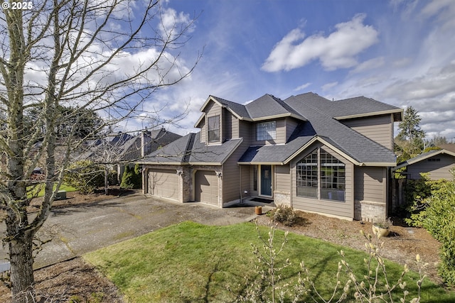 view of front of house featuring aphalt driveway, brick siding, a front lawn, and roof with shingles