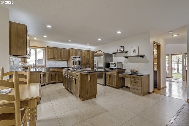 kitchen with open shelves, a kitchen island, dark countertops, recessed lighting, and stainless steel appliances