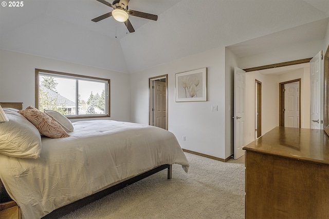 bedroom featuring vaulted ceiling, a ceiling fan, baseboards, and light carpet