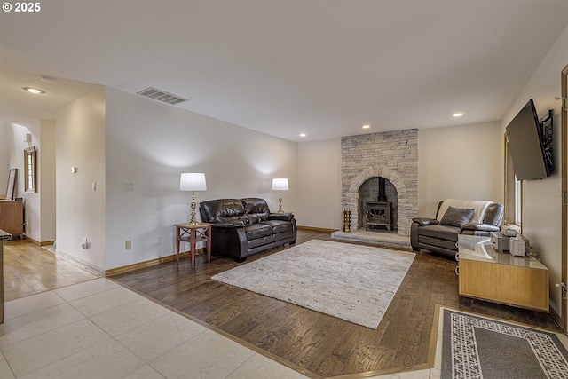 living room with recessed lighting, baseboards, visible vents, and tile patterned flooring