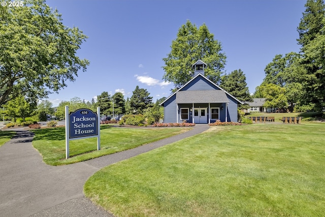 view of property's community with a yard
