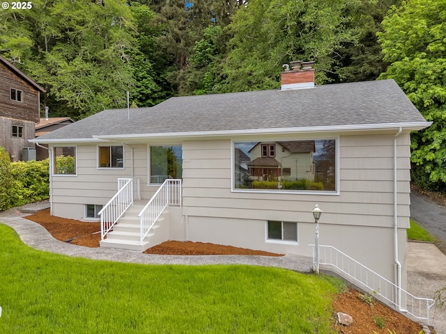 4915 Leif Erikson Dr, Astoria, OR 97103 - ranch-style house featuring a front yard, a chimney, and roof with shingles