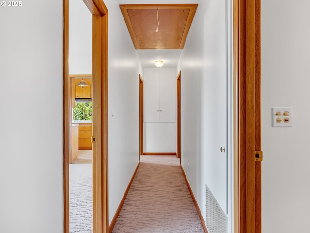 4915 Leif Erikson Dr, Astoria, OR 97103 - corridor with attic access, carpet floors, and baseboards