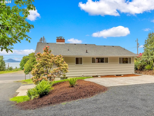 4915 Leif Erikson Dr, Astoria, OR 97103 - view of front facade featuring a chimney, a patio, and a shingled roof