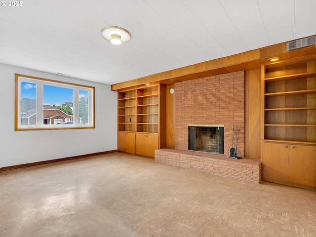 4915 Leif Erikson Dr, Astoria, OR 97103 - unfurnished living room with built in features, baseboards, and a brick fireplace