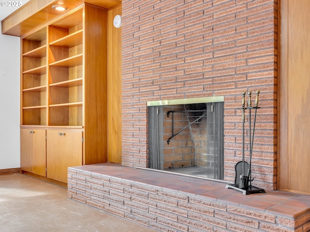 4915 Leif Erikson Dr, Astoria, OR 97103 - detailed view of baseboards, a large fireplace, and a smoke detector