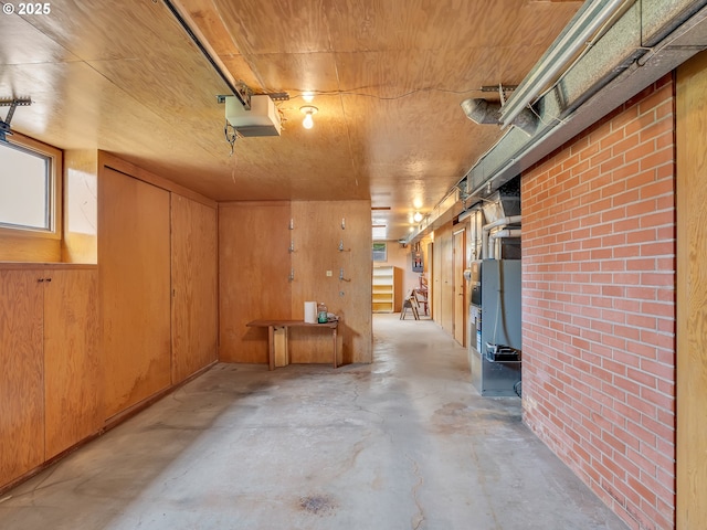 4915 Leif Erikson Dr, Astoria, OR 97103 - garage with a garage door opener and wood walls