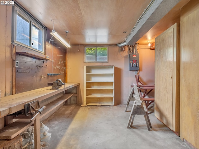 4915 Leif Erikson Dr, Astoria, OR 97103 - miscellaneous room featuring a workshop area, unfinished concrete floors, and electric panel