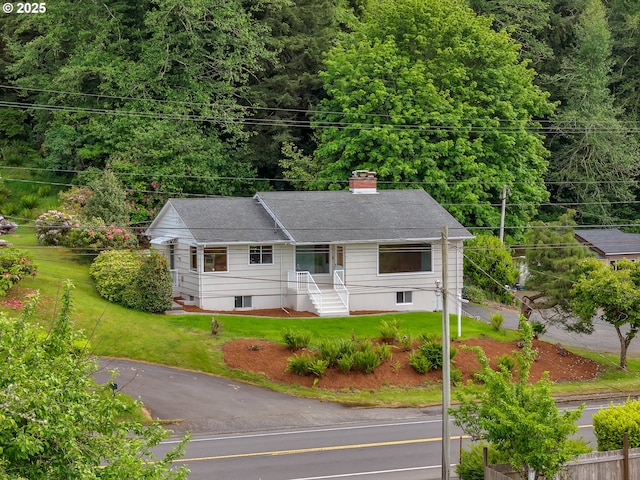 4915 Leif Erikson Dr, Astoria, OR 97103 - view of front of property with a chimney and a front yard