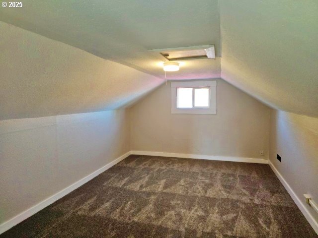 967 NW 2nd St, Prineville, OR 97754 - bonus room with carpet floors, lofted ceiling, and attic access