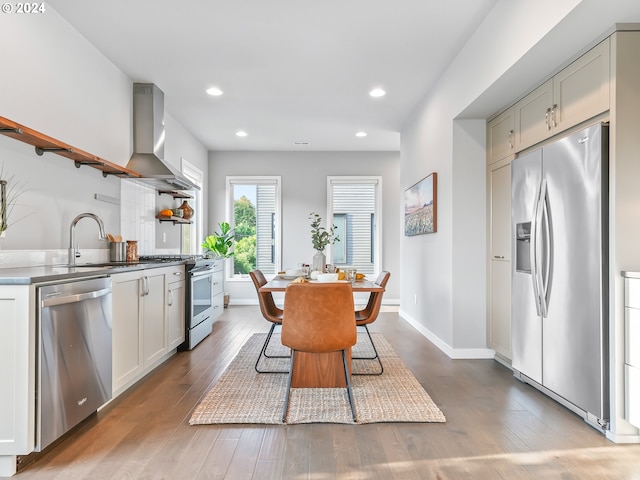 dining room featuring light wood-type flooring, baseboards, and recessed lighting