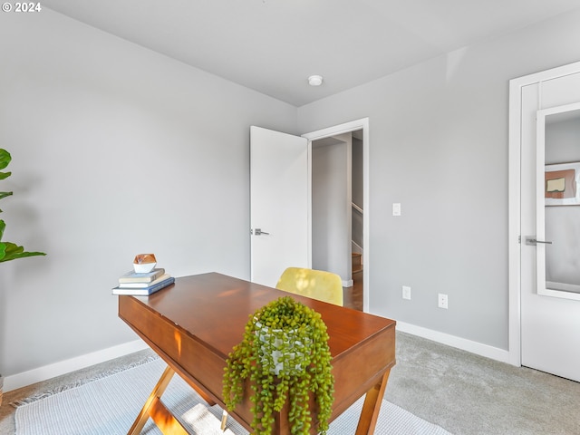 office area with light colored carpet and baseboards