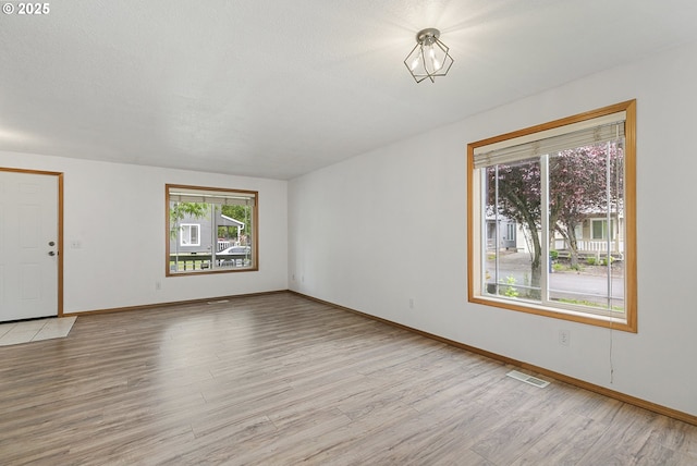 18450 SW Longacre St, Beaverton, OR 97003 - spare room with light wood finished floors and baseboards