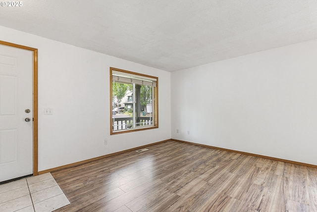 18450 SW Longacre St, Beaverton, OR 97003 - empty room with light wood-style floors and baseboards