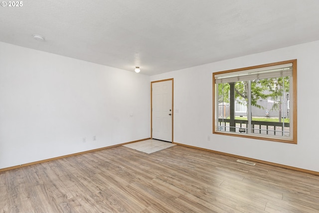 18450 SW Longacre St, Beaverton, OR 97003 - unfurnished room featuring light wood finished floors, baseboards, and a smoke detector