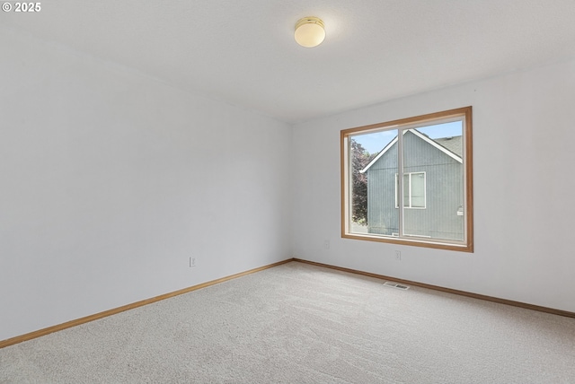 18450 SW Longacre St, Beaverton, OR 97003 - spare room featuring light carpet and baseboards