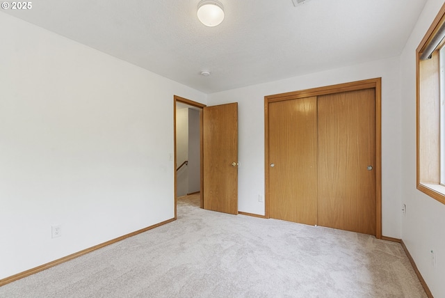 18450 SW Longacre St, Beaverton, OR 97003 - unfurnished bedroom featuring carpet floors, a closet, and baseboards