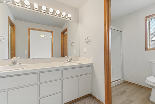 18450 SW Longacre St, Beaverton, OR 97003 - full bath with toilet, a stall shower, double vanity, wood finished floors, and baseboards