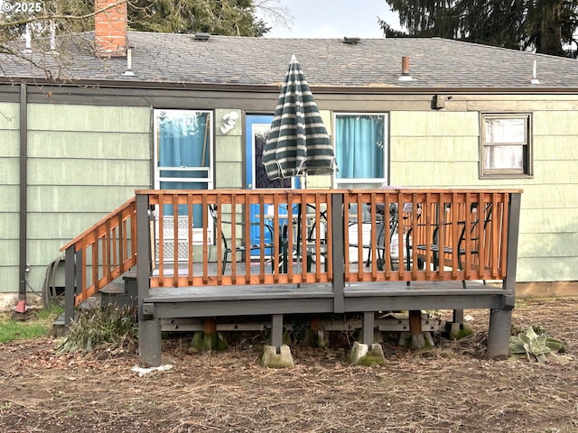 back of house featuring a wooden deck