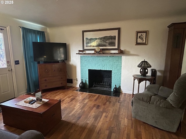 living room featuring a fireplace and hardwood / wood-style floors