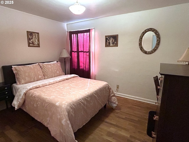 bedroom featuring dark hardwood / wood-style flooring