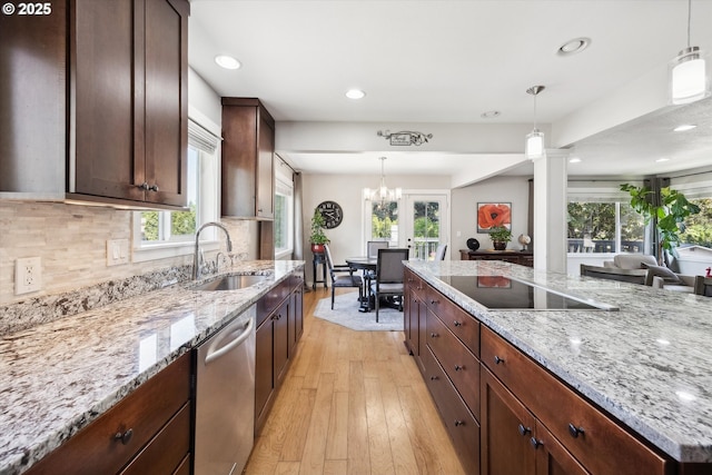 kitchen with a sink, dishwasher, black electric cooktop, light wood-style flooring, and recessed lighting
