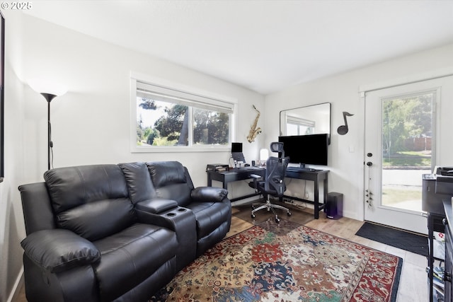 home office with wood finished floors