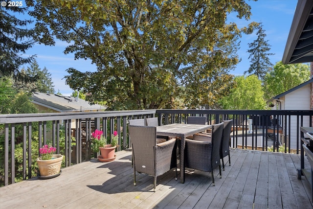 wooden deck featuring outdoor dining space