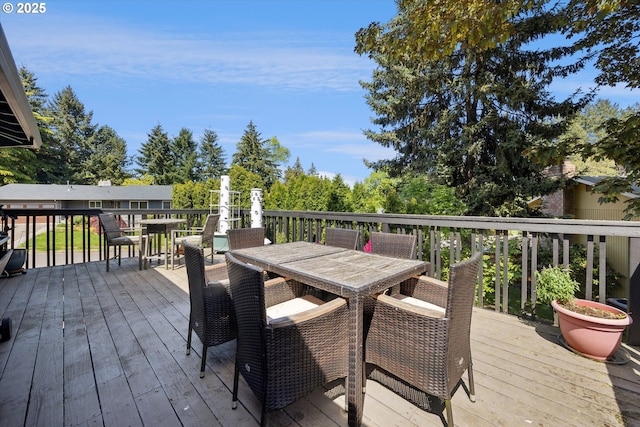 wooden deck with outdoor dining area