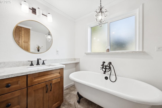 full bathroom featuring a freestanding tub, ornamental molding, a wealth of natural light, and vanity