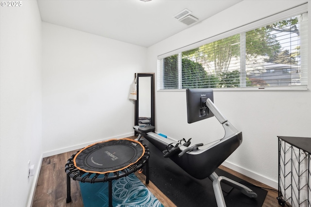 miscellaneous room with baseboards and wood finished floors