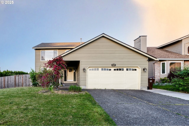 17510 NW Fieldstone Dr, Beaverton, OR 97006 - view of front of home with asphalt driveway, an attached garage, a chimney, and roof with shingles