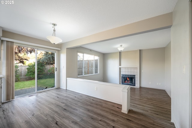 17510 NW Fieldstone Dr, Beaverton, OR 97006 - unfurnished living room with wood finished floors and a fireplace