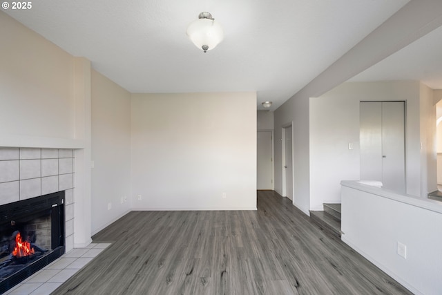 17510 NW Fieldstone Dr, Beaverton, OR 97006 - unfurnished living room featuring wood finished floors and a fireplace