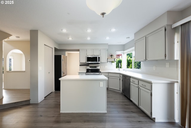 17510 NW Fieldstone Dr, Beaverton, OR 97006 - kitchen featuring stainless steel appliances, recessed lighting, a center island, light countertops, and dark wood-style flooring